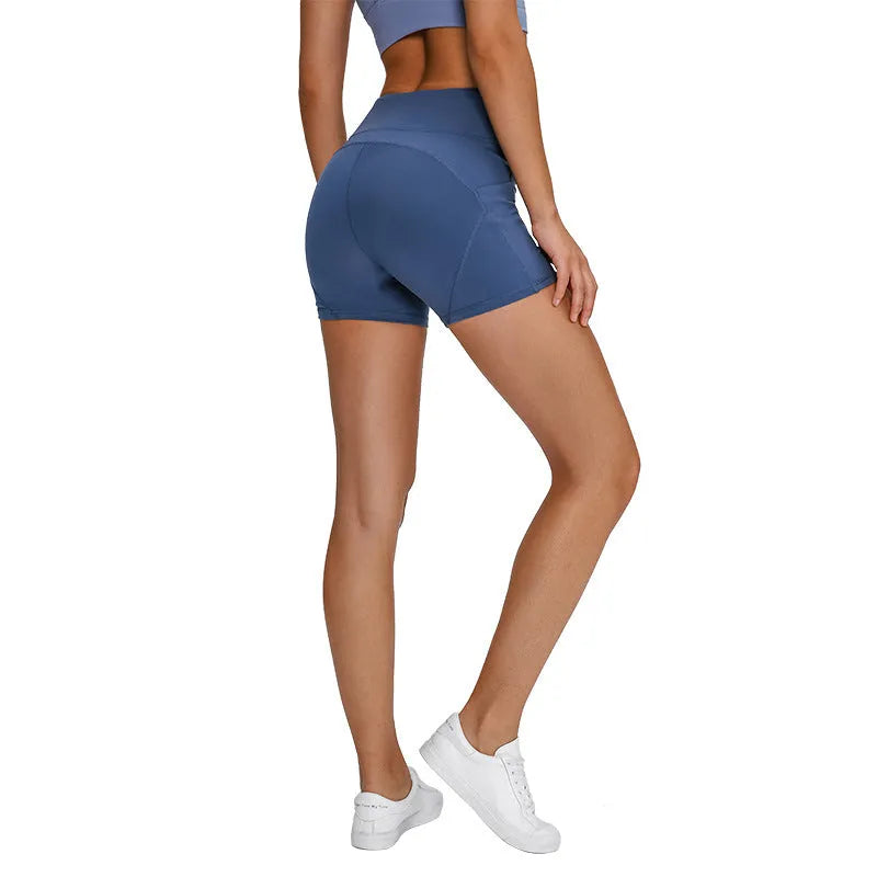 SHINBENE women's high waisted athletic shorts in black with two side pockets and cotton feel nylon spandex fabric