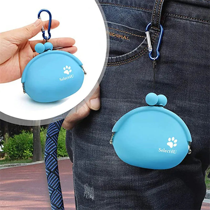 Yellow silicone dog training treat pouch with hook-and-loop closure, shown clipped to a waistband.
