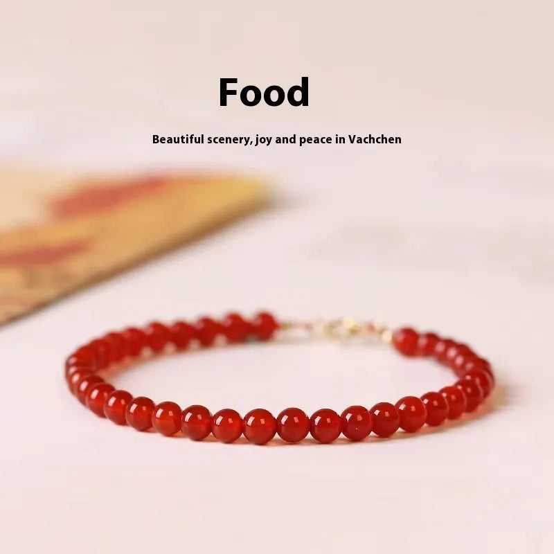 A classic style ultra-thin red agate bracelet for women on a white background.