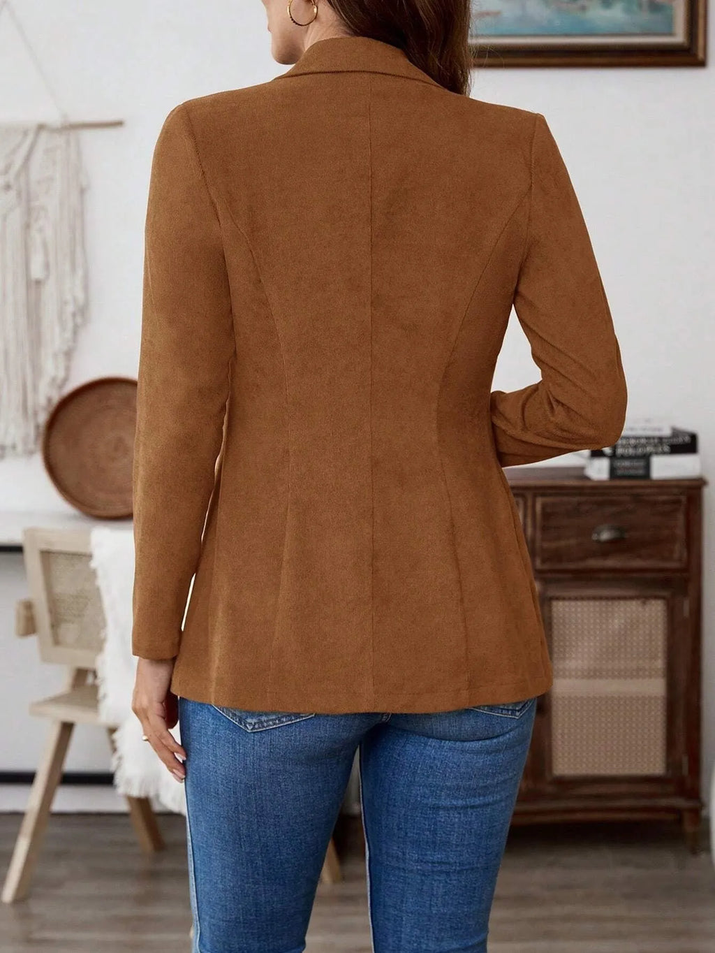 Brown single-breasted men's leisure suit coat with lapel collar and long sleeves.