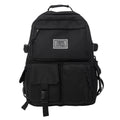 Nylon student backpack in black colour showing laptop compartment and three-dimensional pockets