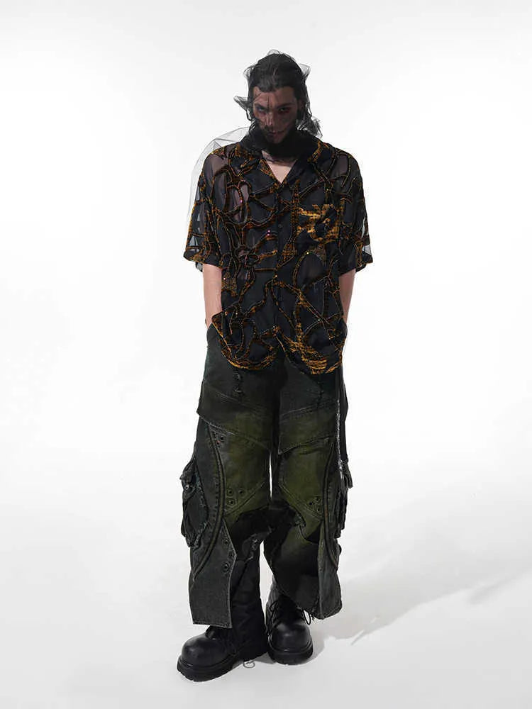 Man's black and grey short-sleeved shirt with translucent snake pattern, loose fit with lapel collar.