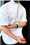 Men's white T-shirt with button details and a round hemline on a hanger.