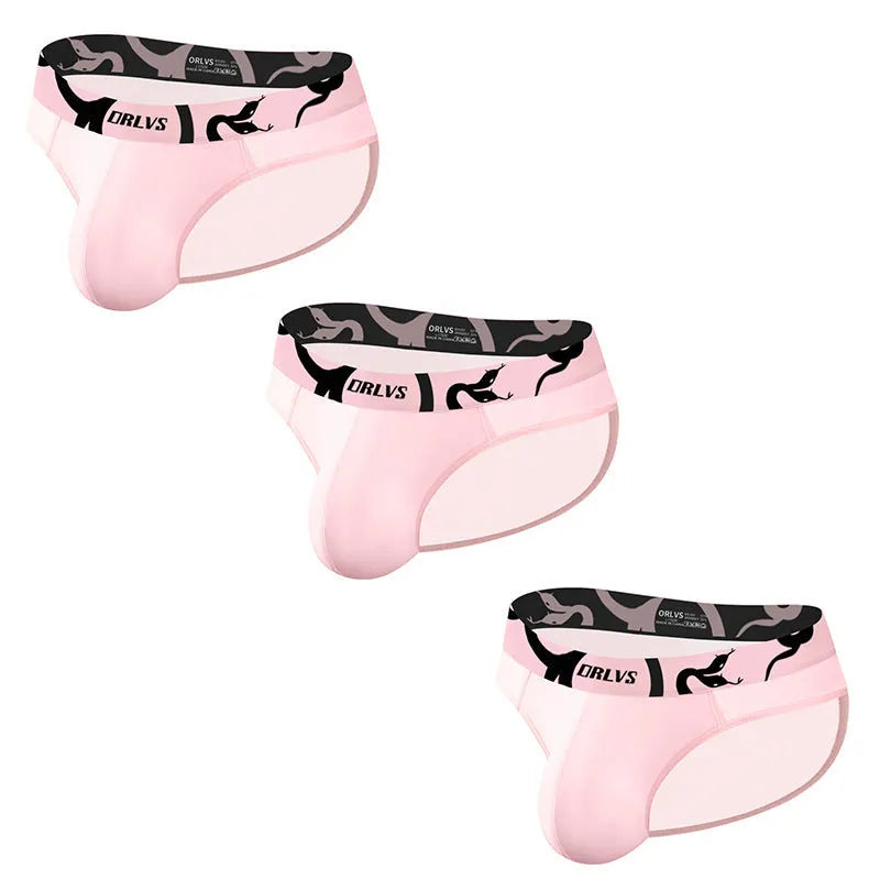 Men's solid colour cotton modal boxer shorts in black, pink, or red on a white background.