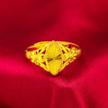 Gold-coloured geometric flower ring with textured surface and open design on brass