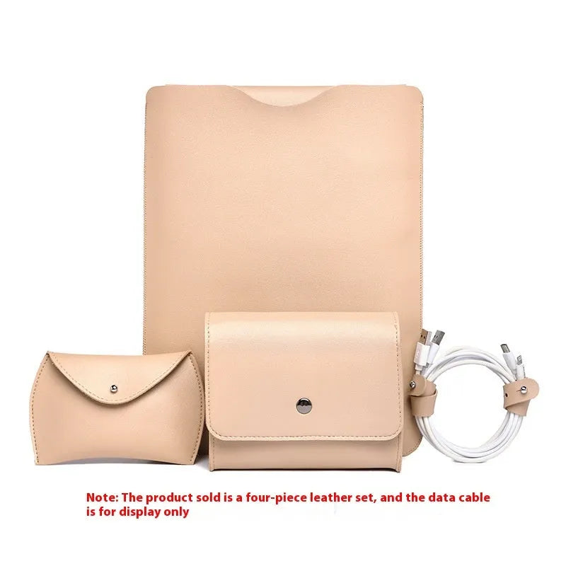 Set of four brown imitation leather laptop corner protectors on a grey laptop.