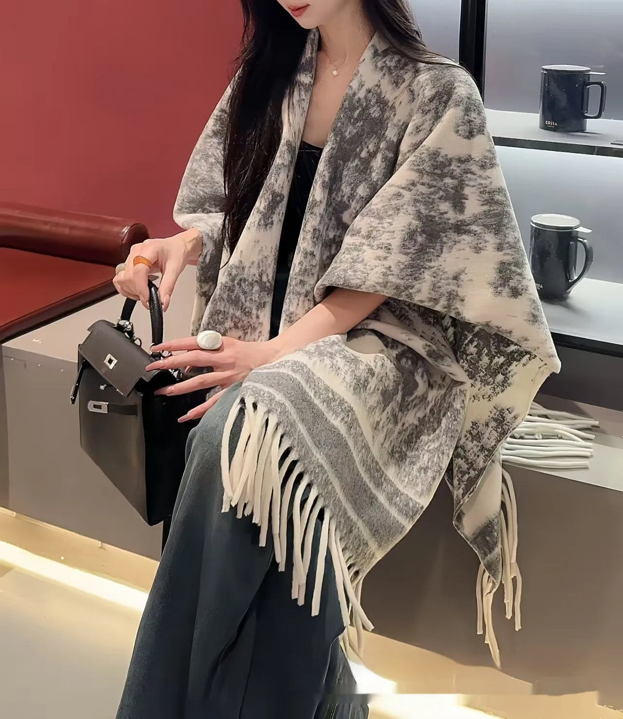 Women's casual polyester tassel scarf cape in a free size shawl style.