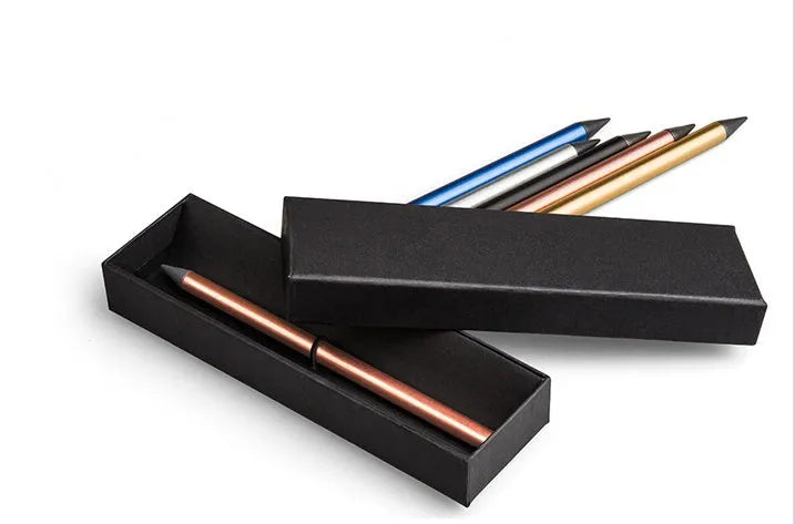 Silver inkless metal pen with a 0.5 mm alloy tip, shown with its spare nib and carry bag on a desk.
