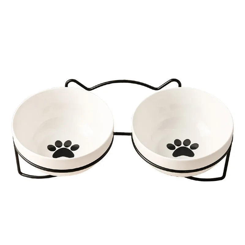 White ceramic cat bowl with cat paw pattern and black iron frame with cat ears