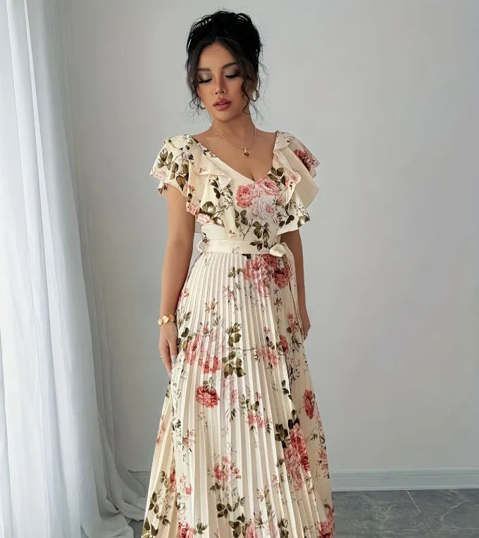 Apricot-coloured women's floral print dress with a V-neck, ruffled short sleeves, and an oversized pleated skirt.