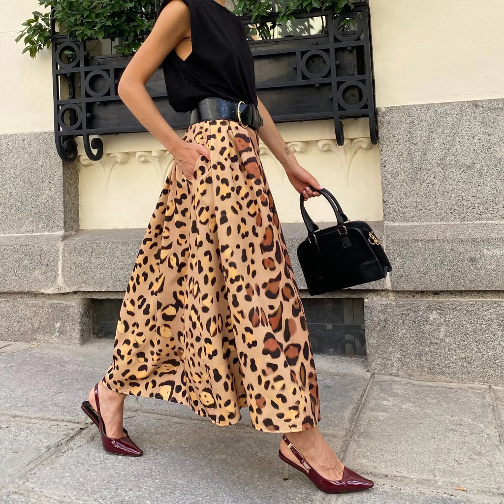 Women's brown leopard print A-line long skirt with a big hem on a hanger.