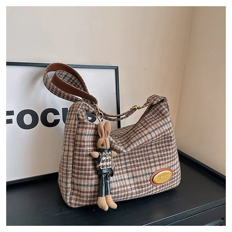 Women's large soft wool crossbody shoulder bag in a horizontal square shape, shown in red, khaki, and brown colour options.