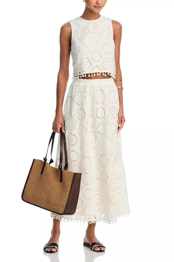 White women's retro co-ord suit with sleeveless top and embroidered long skirt