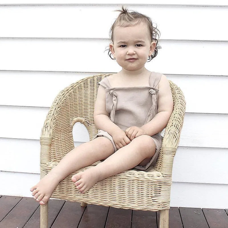 Children's khaki cotton overalls shorts with bow detail and straps, front view