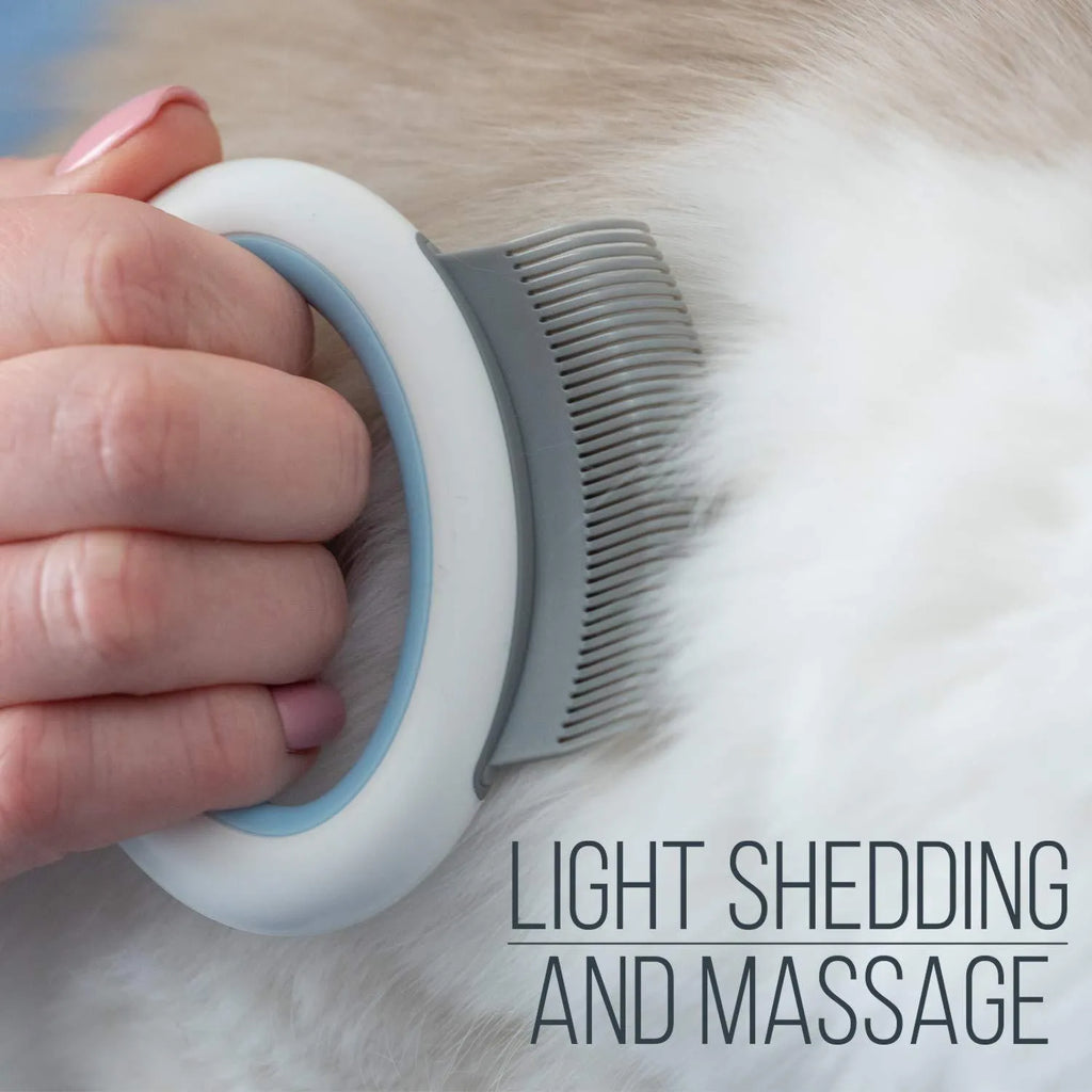 Blue ergonomic pet deshedding comb for cats and dogs on a white background.