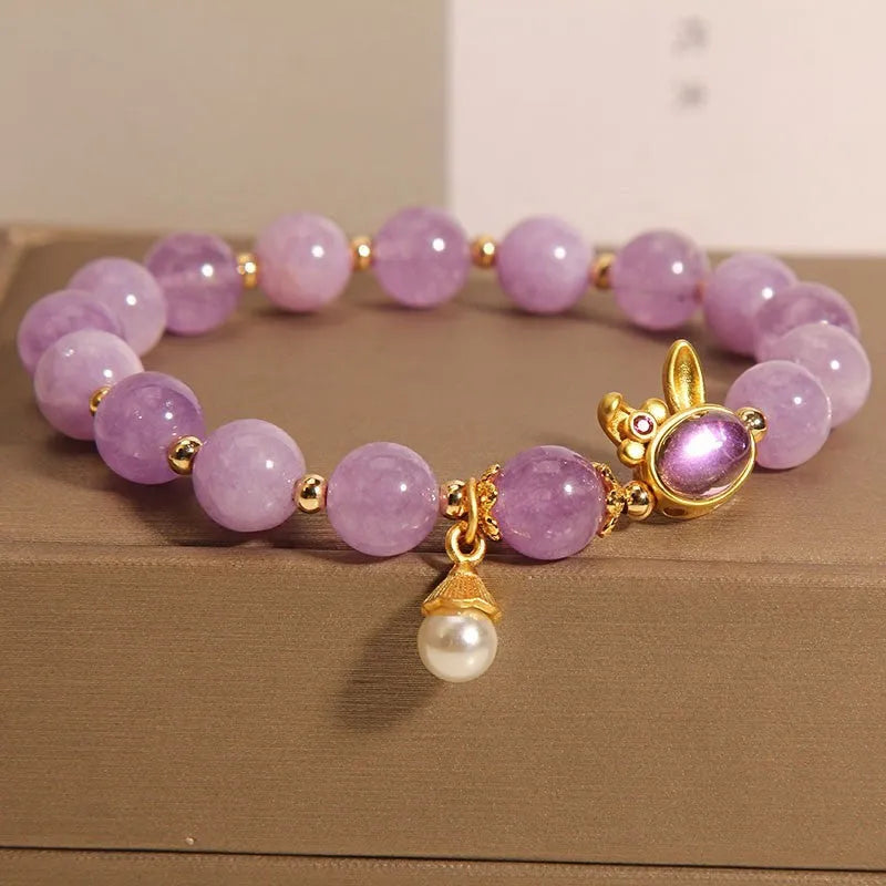 Natural mauve jade hare head crystal bracelet in Mori style with purplish red accents.