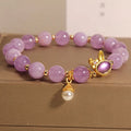 Natural mauve jade hare head crystal bracelet in Mori style with purplish red accents.