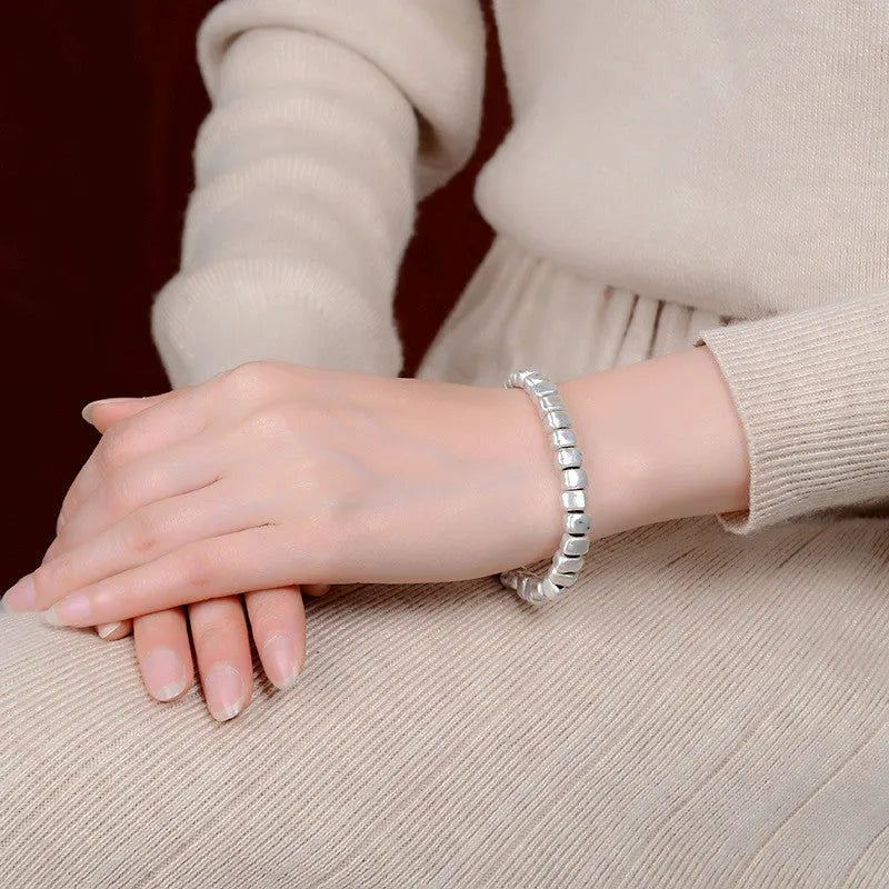 Handmade wooden bracelet with irregular silver square charm on elastic band