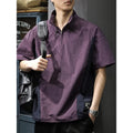 Brown men's half-zip stand collar short-sleeve shirt on a hanger, showing loose fit and ice silk fabric texture.