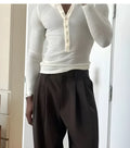 Apricot colour men's long-sleeve ribbed cotton Henley top with a buttoned placket.