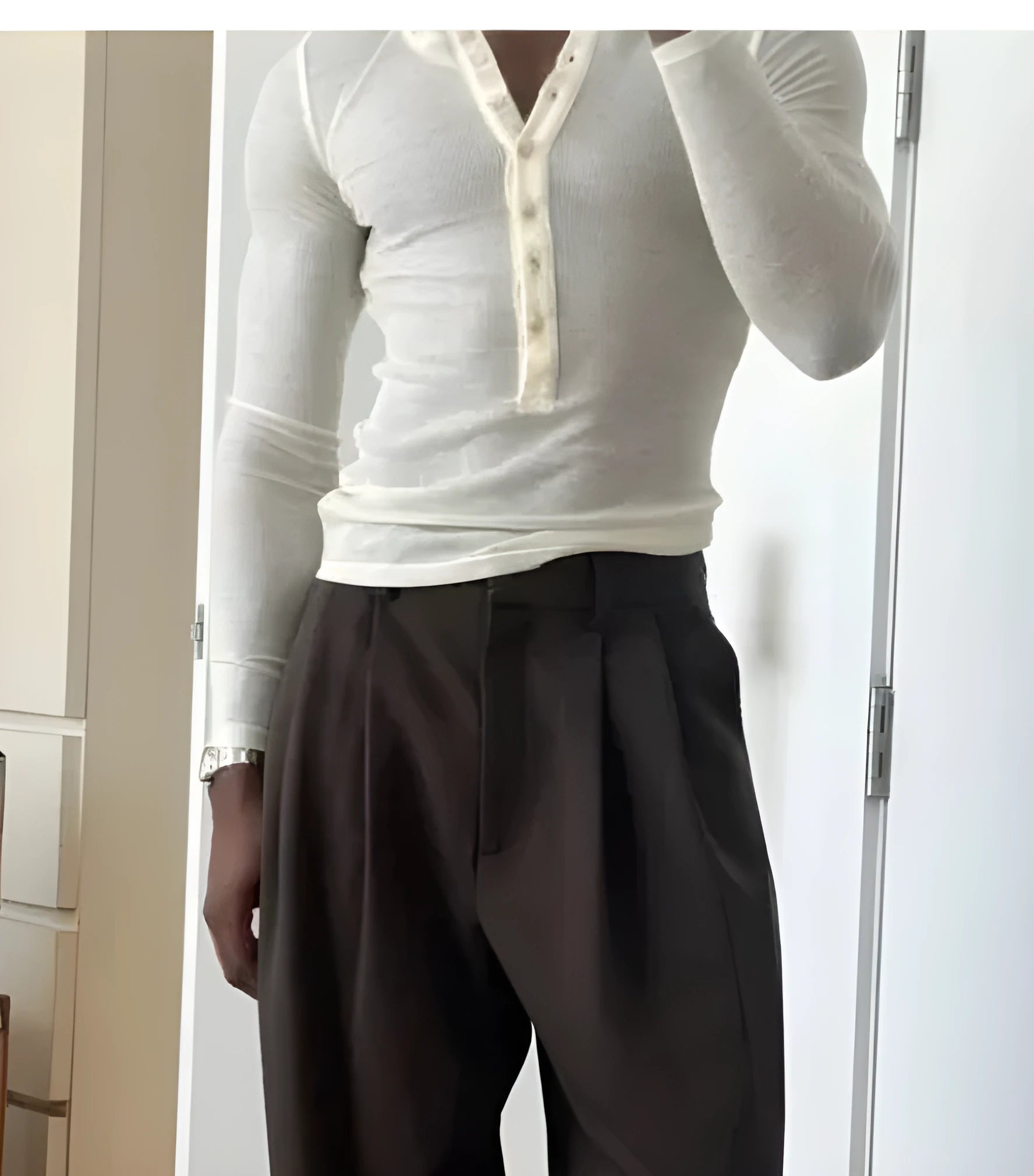 Apricot colour men's long-sleeve ribbed cotton Henley top with a buttoned placket.