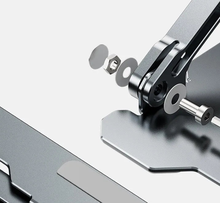 Grey portable aluminum laptop stand shown folded and in use with a silver laptop, demonstrating its adjustable angle.