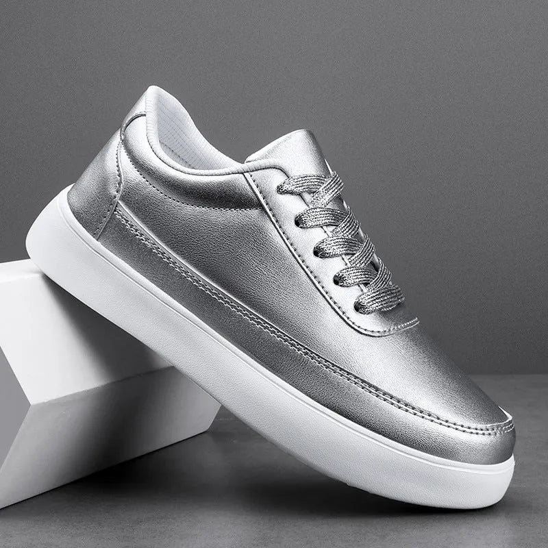 Women's white leather flat casual shoes with front lace-up design on a neutral background.
