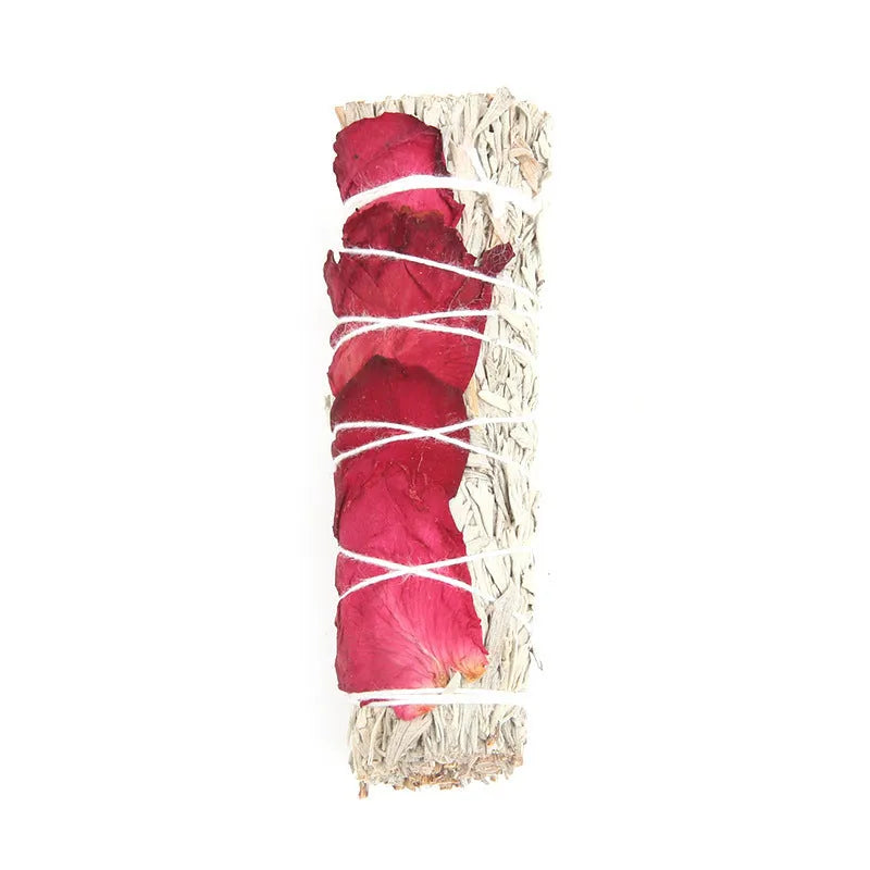 White sage and red rose petal colourful aromatherapy incense bundle on a wooden table