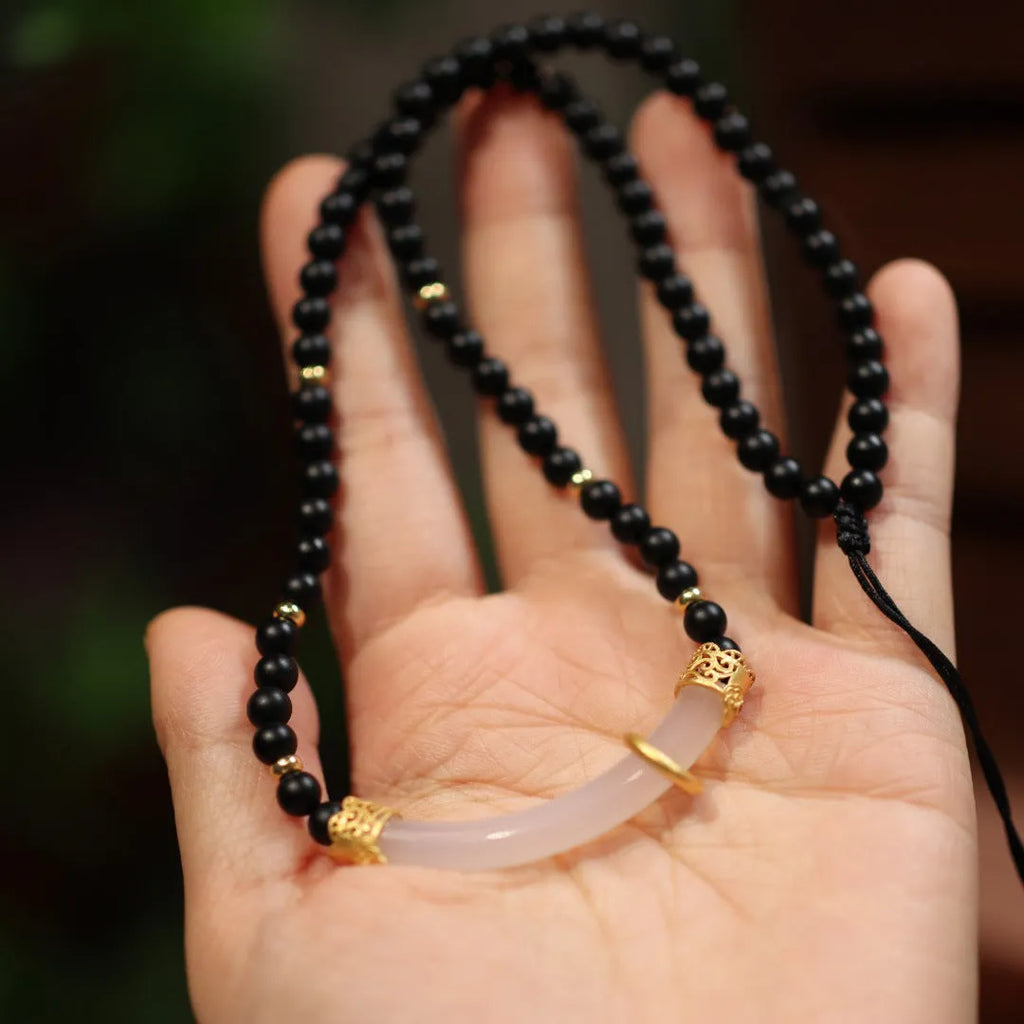 Frosted black agate pendant necklace with white chalcedony detailing on 925 silver chain