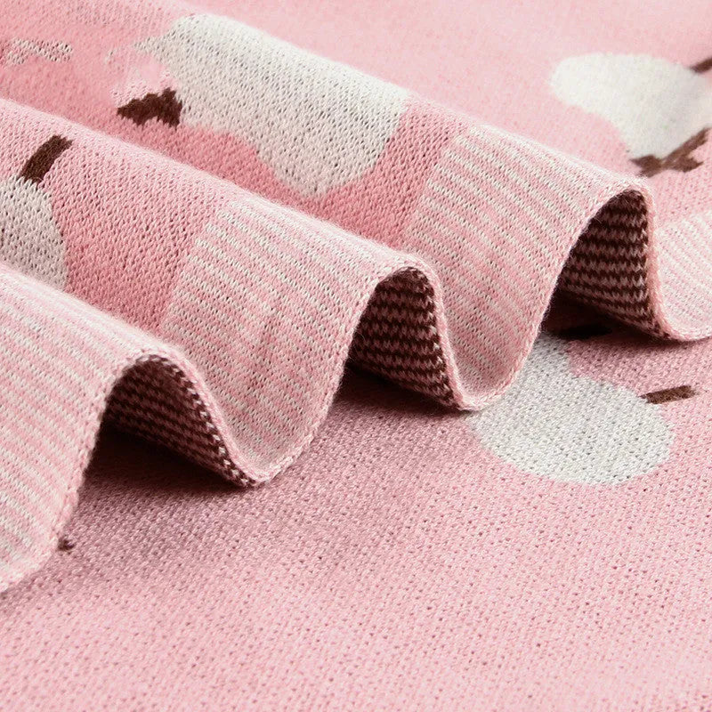 Pink and grey 100% cotton baby sheepskin blanket measuring 100x80cm for cots and prams.