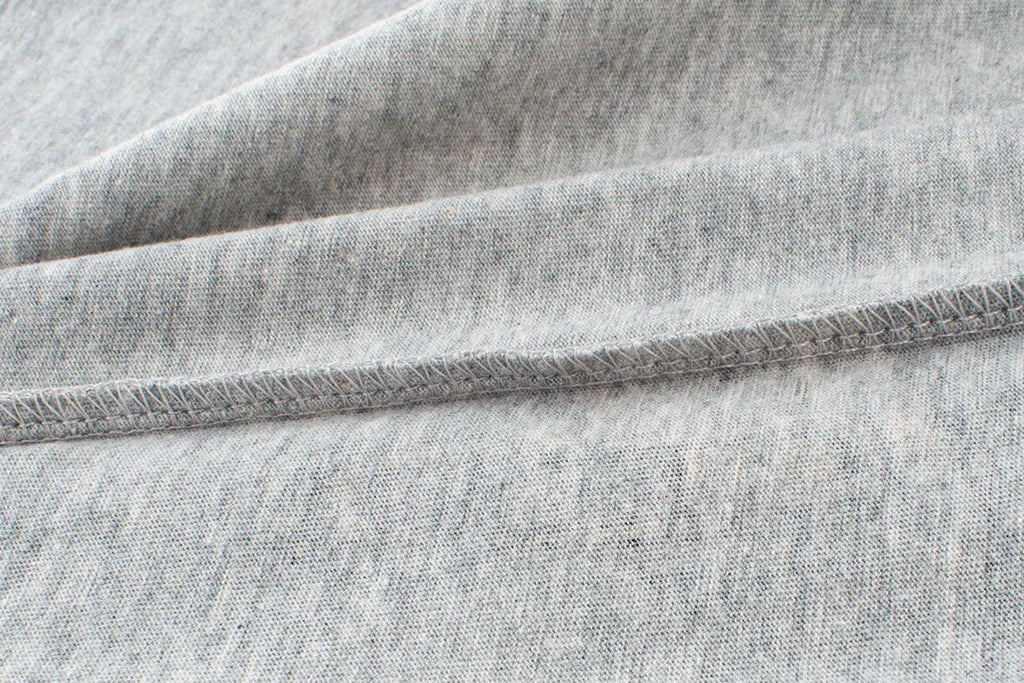 Children's light grey cartoon print cotton t-shirt with short sleeves and a round neck.