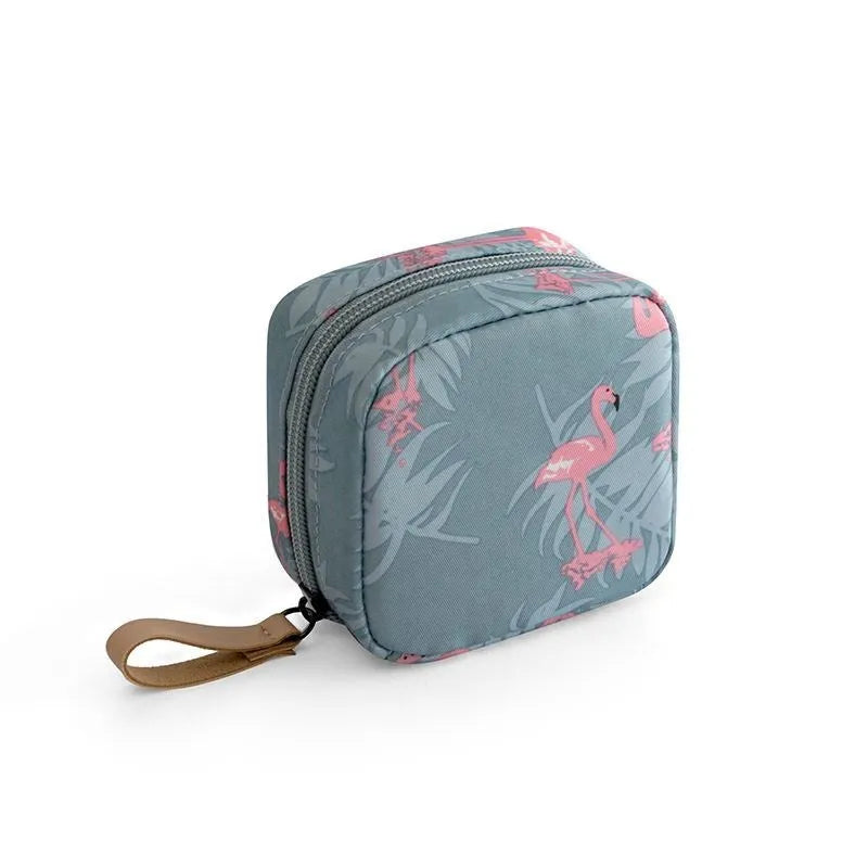 A cube-shaped cloth makeup storage bag in a selection of colours including blue, pink, white, and white pink.