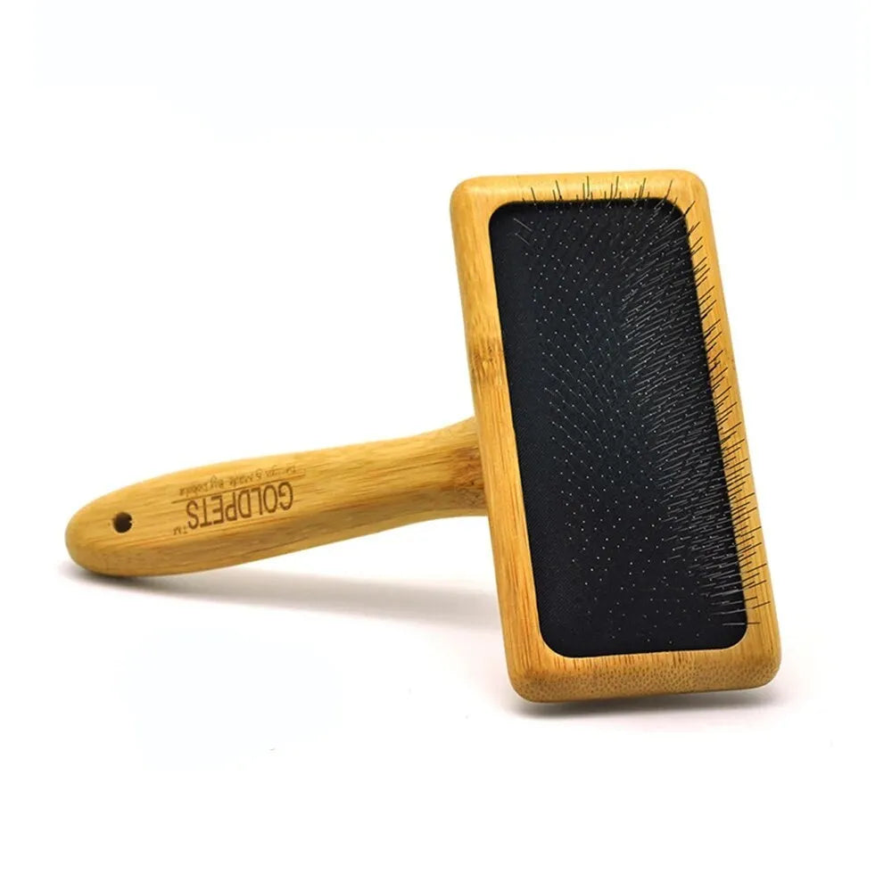 Goldpets bamboo slicker brush with wooden handle and stainless steel pins for grooming cats and dogs.