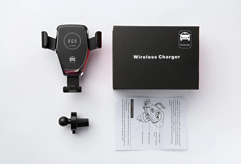 Black car wireless phone charger mounted on air vent, holding an iPhone with automatic clamping arms.