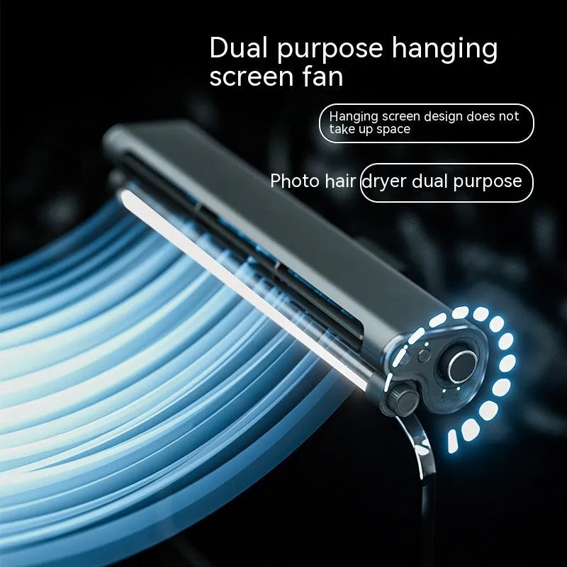 Black clip-on bladeless fan with integrated light attached to a laptop screen.