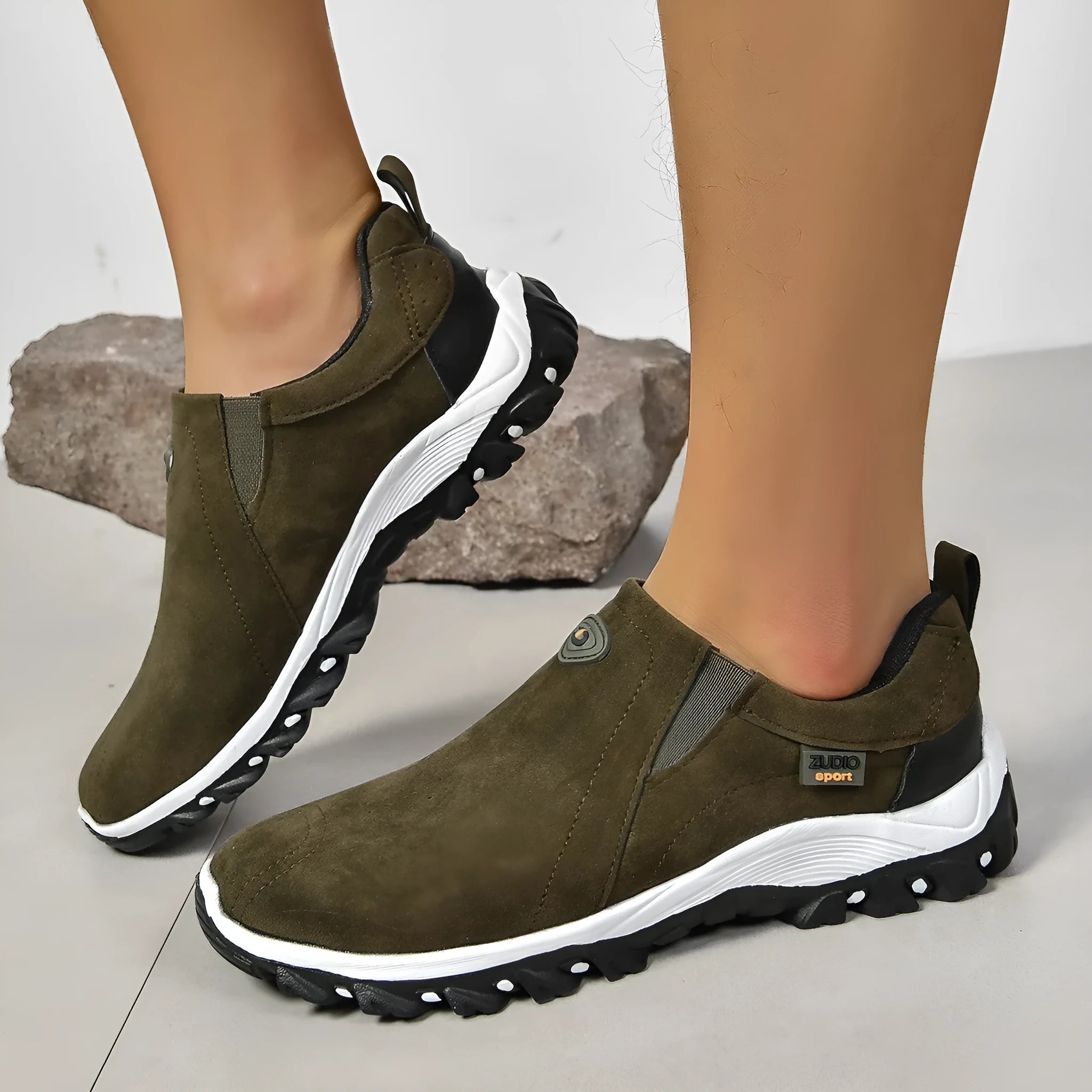 Men's thin oversleeve shoe cover in light brown with a round toe, shallow mouth, and rubber sole.