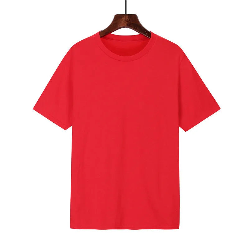 A man's loose-fitting black cotton t-shirt with short sleeves on a hanger.