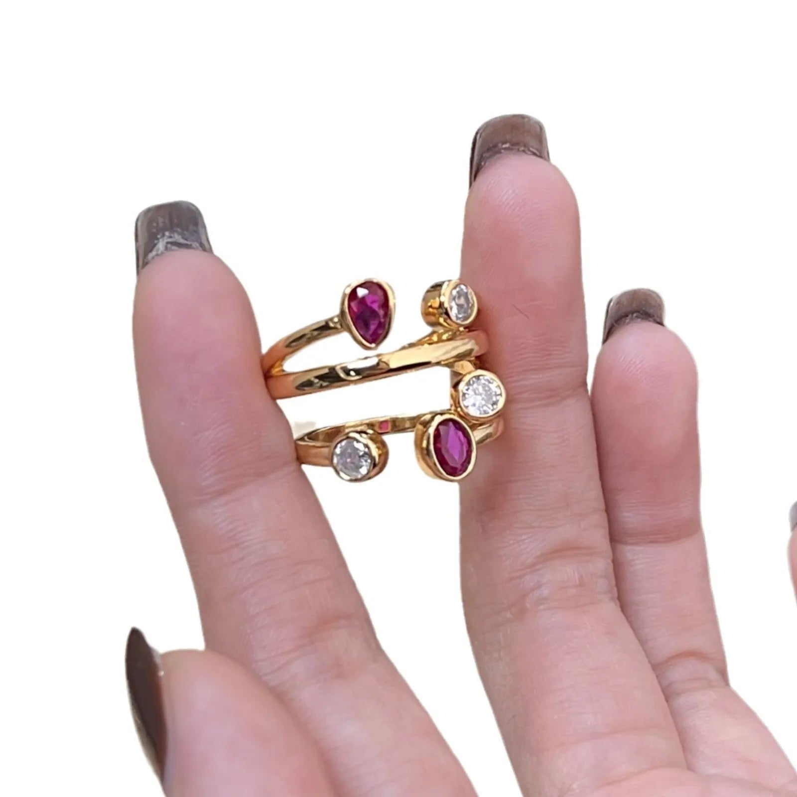 Geometric double-headed ring with irregular cross shape and two-colour electroplated finish