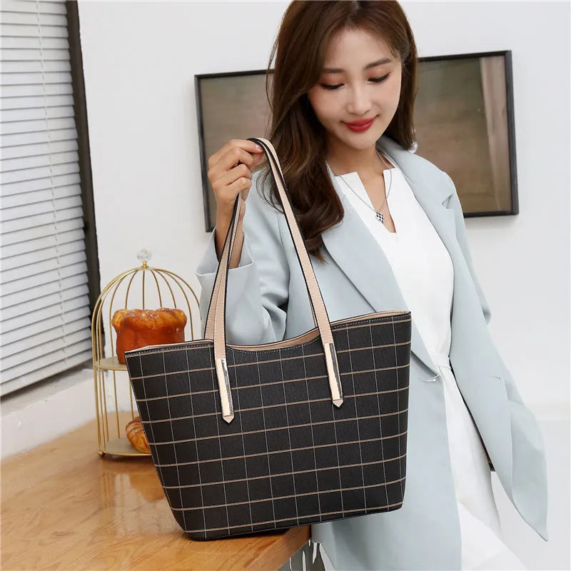 Korean fashion four-piece bag set in black with cartoon anime pattern and sewing thread detail on cross square PU tote bag