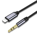 Silver and black headphone audio cable with 3.5mm jack for car stereo connection.