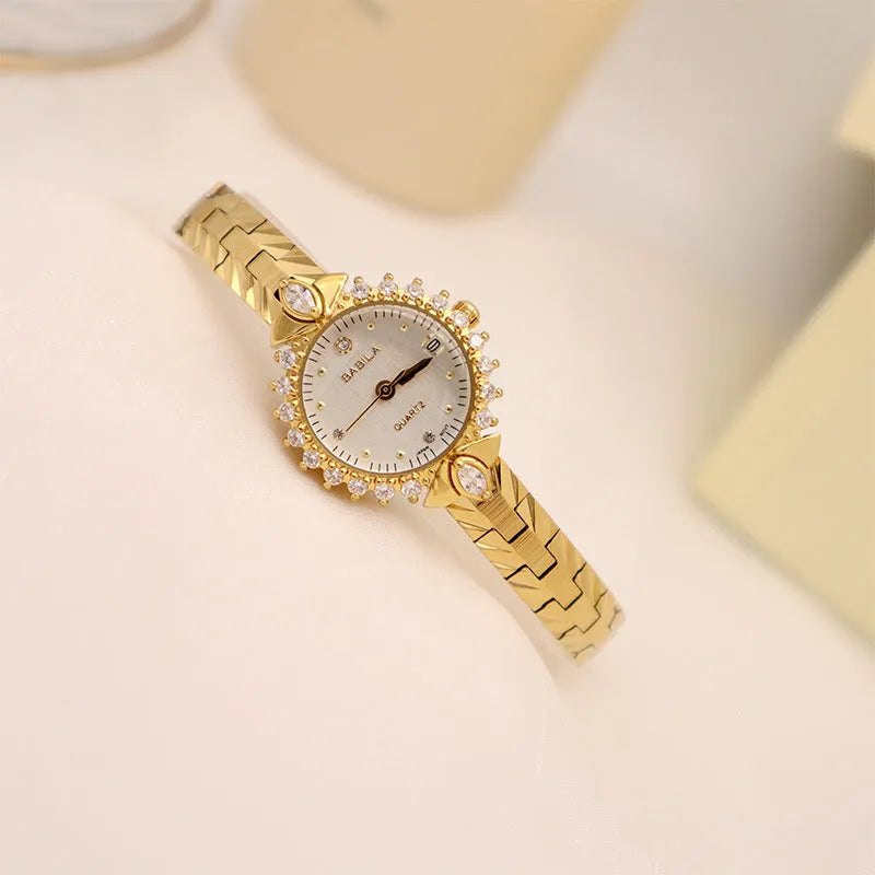 Vintage gold-toned ladies bracelet watch with diamond embossed links and quartz movement