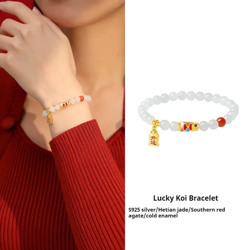 S925 sterling silver bracelet with a 6mm Hetian jade bead and a detailed cold enamel koi fish charm.