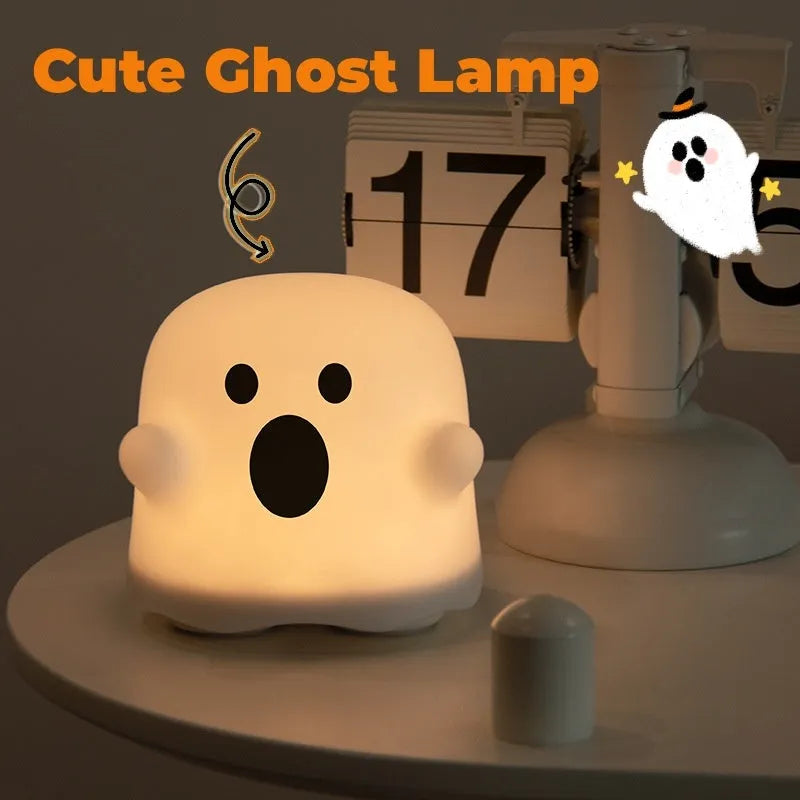 White portable LED touch sensor night light on a wooden bedside table.