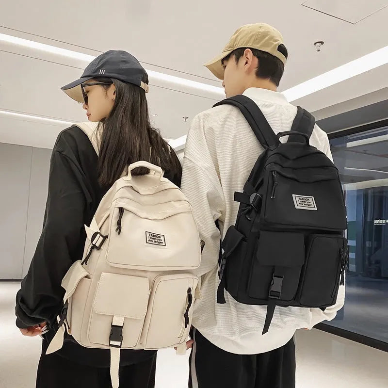 Nylon student backpack in black colour showing laptop compartment and three-dimensional pockets