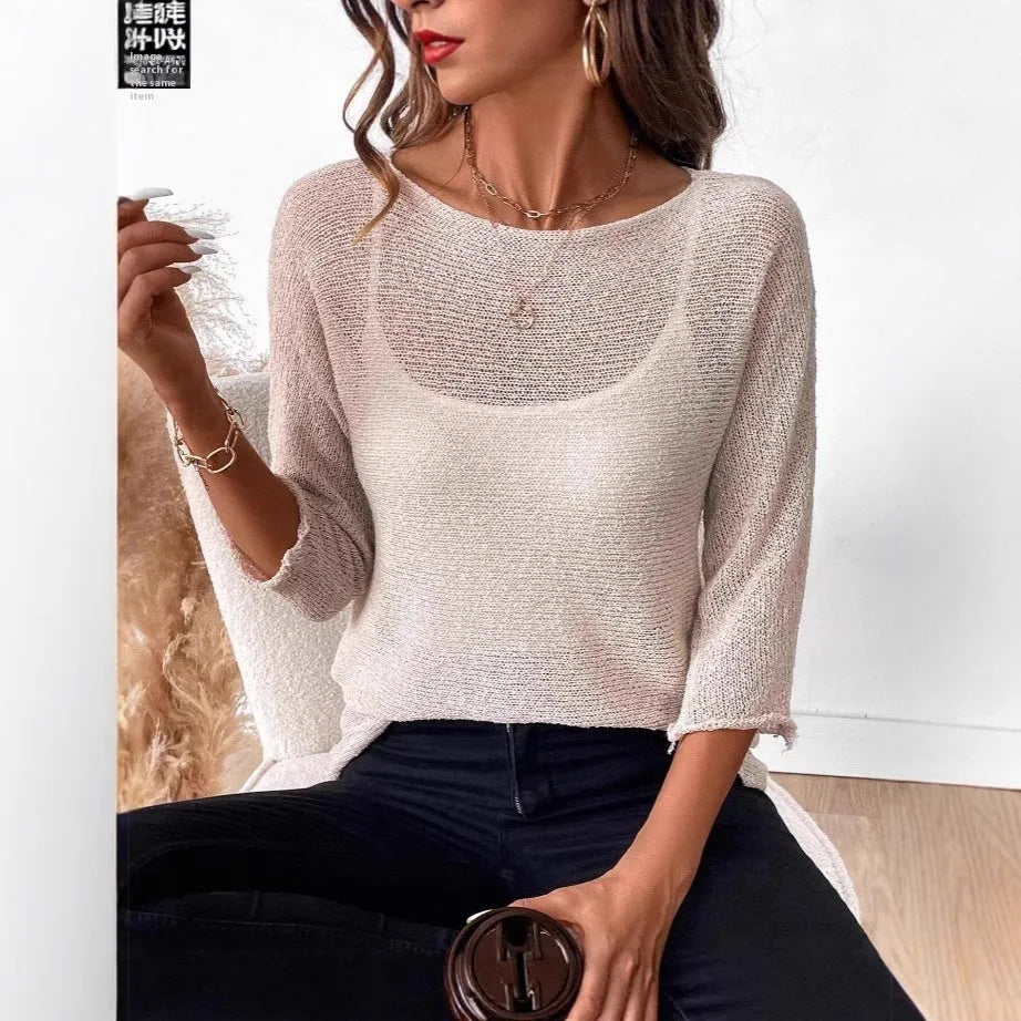 Women's off-shoulder knitted jumper in light blue with a 3D pattern and 3/4 sleeves.
