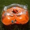 Baby neck swimming ring in green PVC with 40cm outer diameter and adjustable inner collar, floating on water