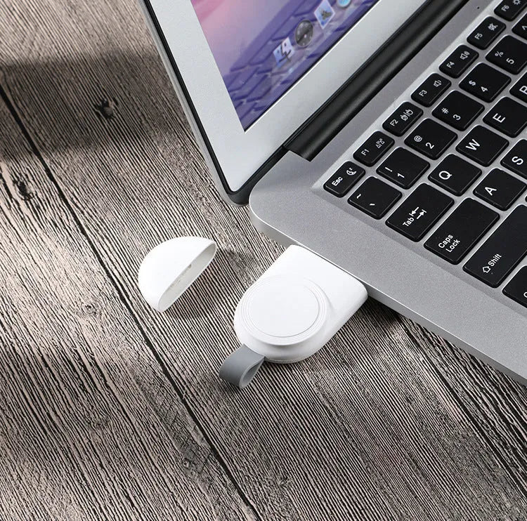 White portable wireless charging dock station for Apple Watch with USB cable.