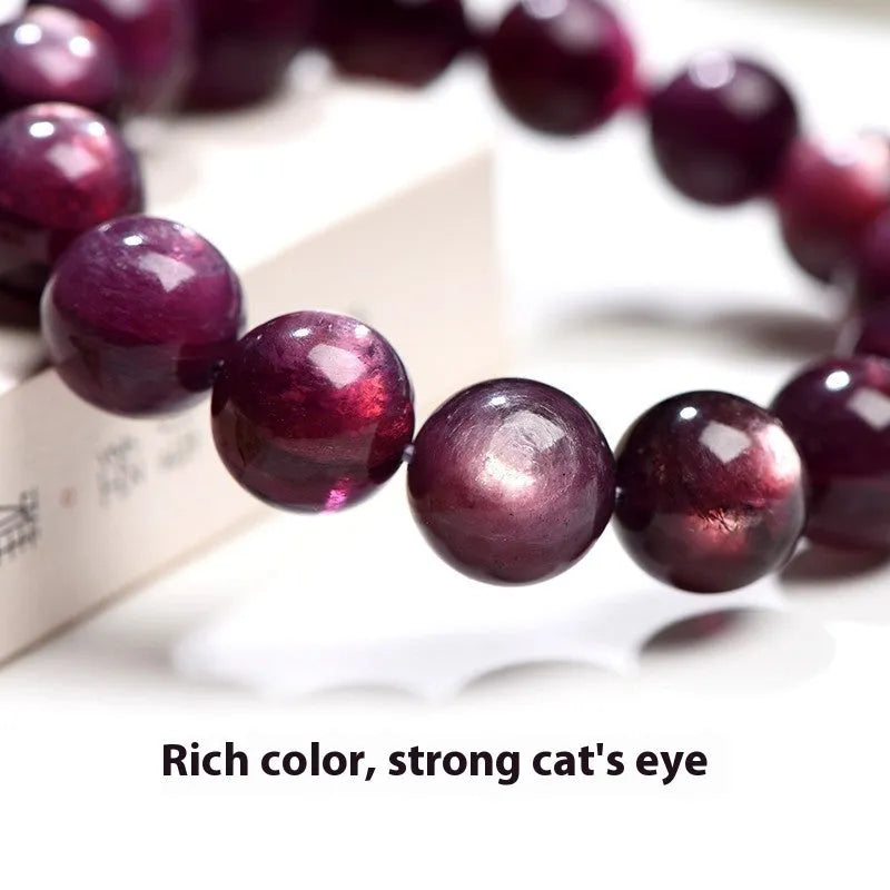 Natural purple lepidolite crystal bracelet with round polished beads in geometric arrangement