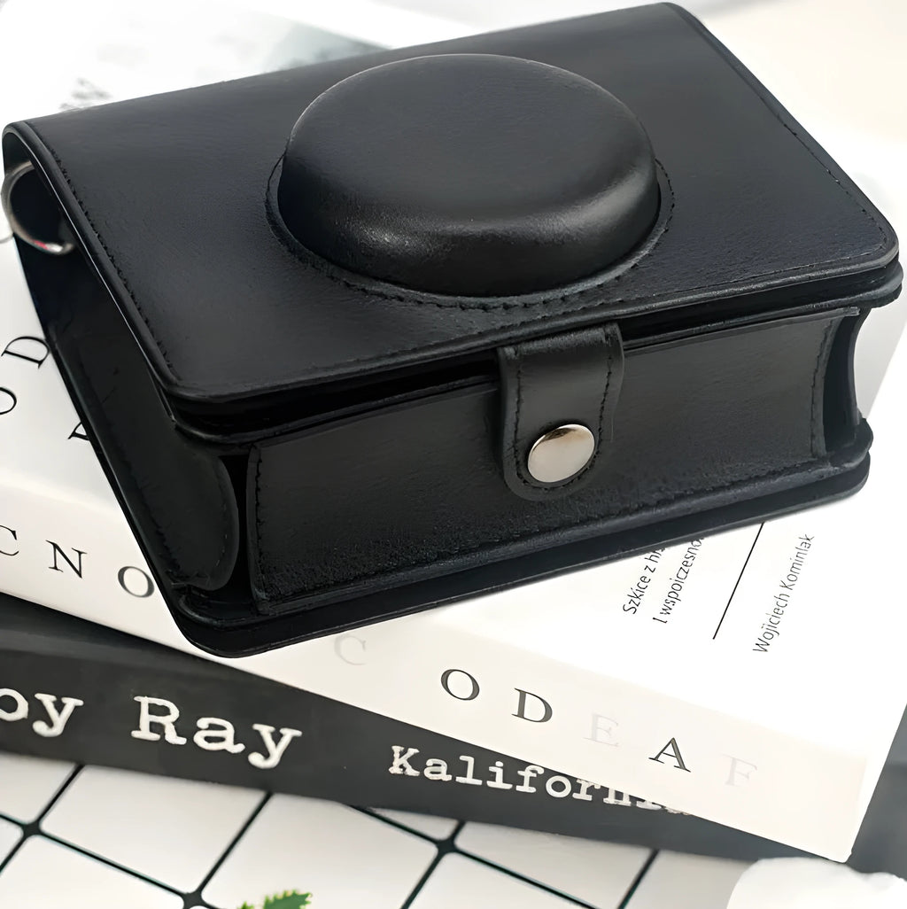 Retro camera storage case with curved shoulder strap in solid colour options including black skin feeling material