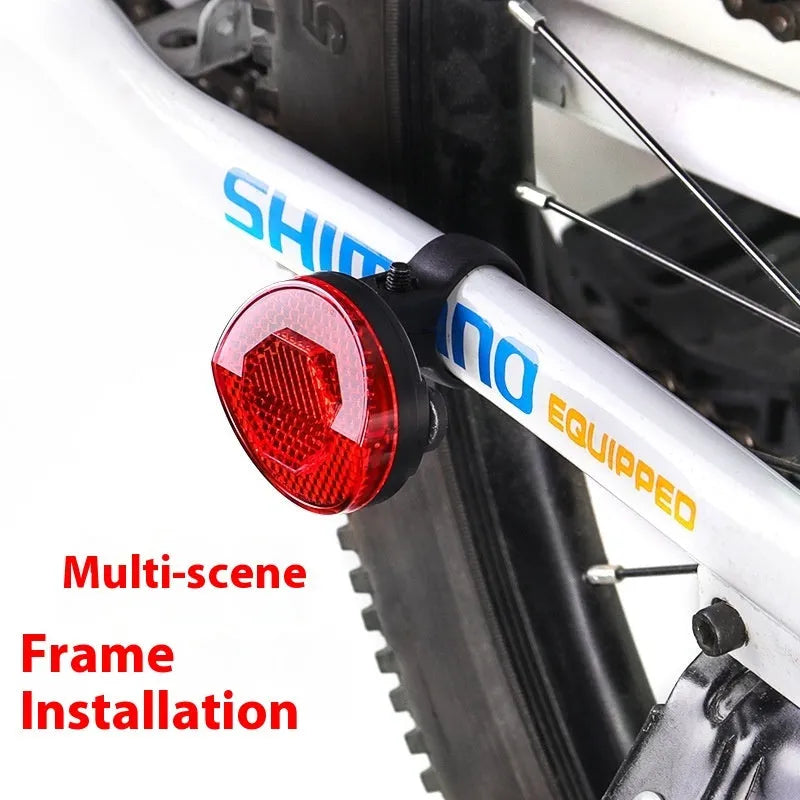 Plastic bicycle taillight bracket with anti-theft features mounted on seat post in red colour